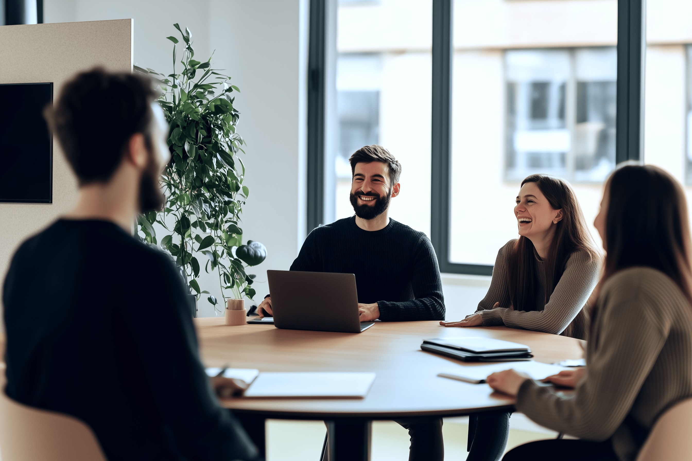 A professional group discussing challenges around a conference table